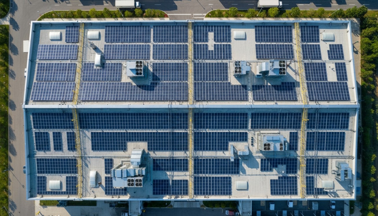 Aerial view of a commercial rooftop solar layout showing how roof conditions shape PV module placement